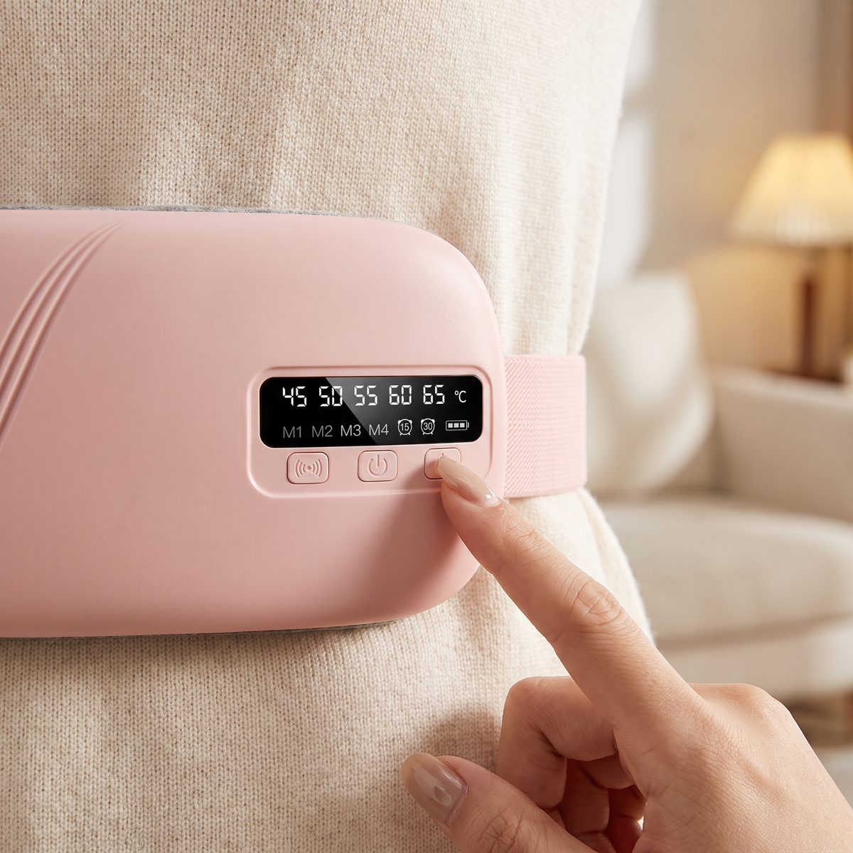 Close-up of the Comfort Belt LED display showing 5 heat levels and 4 vibration modes